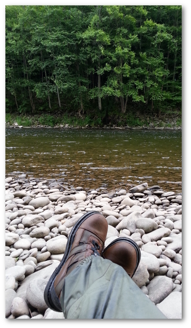 sitting on the rocks by the river